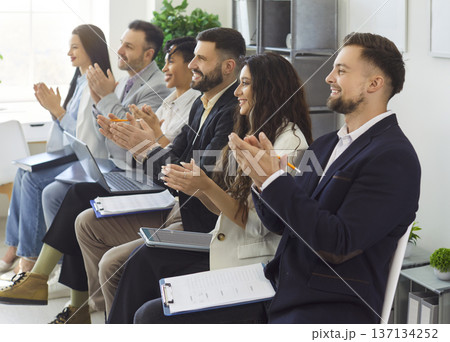 Positive business people making applauds to speaker on business conference, being at workshop Positive business people making applauds to speaker on business conference, being at workshop 137134252