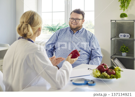 Patient and nutritionist consultation about diet with vegetables and health advice 137134921