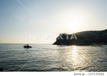 Waves crashing splashing sandy beach on seashore in Antalya Turkey during sunset. Sea vacation travel tourism scene concept. Tranquility and slowing down Waves crashing splashing sandy beach on seashore in Antalya Turkey during sunset. Sea vacation travel tourism scene concept. Tranquility and slowing down 137135692