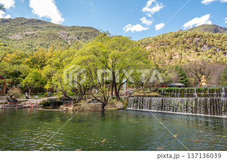 Tranquility view of Jade Water Village in Yunnan, China. Jade Water Village is a scenic spot where hypostatic union of Naxi culture and nature landscape, it was built in 1997. 137136039