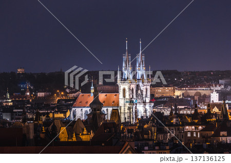 Evening panorama of Prague Old Town with glowing gothic towers of Church of Our Lady before Tyn above historic city roofs in Czech Republic Evening panorama of Prague Old Town with glowing gothic towers of Church of Our Lady before Tyn above historic city roofs in Czech Republic 137136125