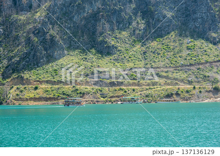 Panoramic Landscape view on green canyon Antalya Turkey with turquoise water mountain cliffs and green forest. Showcasing natural beauty travel tourist destination. Vacation concept 137136129