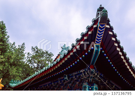 Decorative eaves of historic in Summer Palace architecture highlighting layered roof structure vivid colors craftsmanship and cultural heritage context, Beijing, China Decorative eaves of historic in Summer Palace architecture highlighting layered roof structure vivid colors craftsmanship and cultural heritage context, Beijing, China 137136795