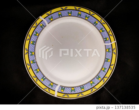 Ceramic plate on a black background. View from above Ceramic plate on a black background. View from above 137138535