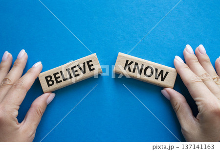 Believe or Know symbol. Concept word Believe or Know on wooden blocks. Businessman hand. Beautiful blue background. Business and Believe or Know concept. Copy space Believe or Know symbol. Concept word Believe or Know on wooden blocks. Businessman hand. Beautiful blue background. Business and Believe or Know concept. Copy space 137141163