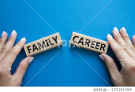 Family or Career symbol. Concept word Family or Career on wooden blocks. Businessman hand. Beautiful blue background. Business and Family or Career concept. Copy space Family or Career symbol. Concept word Family or Career on wooden blocks. Businessman hand. Beautiful blue background. Business and Family or Career concept. Copy space 137141164
