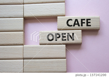 Cafe Open symbol. Concept word Cafe Open on wooden blocks. Beautiful pink background. Business and Cafe Open concept. Copy space 137141200