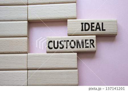 Ideal Customer symbol. Wooden blocks with words Ideal Customer. Beautiful pink background. Business and Ideal Customer concept. Copy space. Ideal Customer symbol. Wooden blocks with words Ideal Customer. Beautiful pink background. Business and Ideal Customer concept. Copy space. 137141201