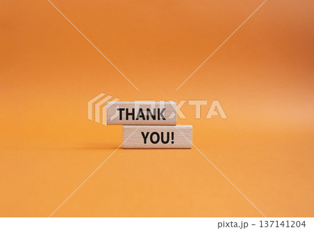 Thank you symbol. Wooden blocks with words Thank you. Beautiful orange background. Business and Thank you concept. Copy space. Thank you symbol. Wooden blocks with words Thank you. Beautiful orange background. Business and Thank you concept. Copy space. 137141204