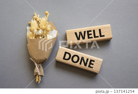 Well done symbol. Wooden blocks with words Well done. Beautiful grey background. Business and Well done concept. Copy space. Well done symbol. Wooden blocks with words Well done. Beautiful grey background. Business and Well done concept. Copy space. 137141254
