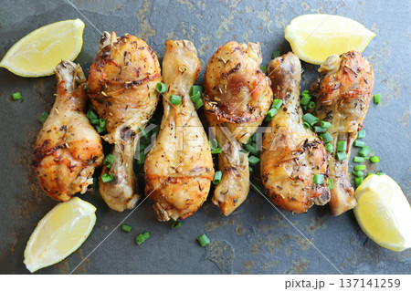 Delicious Roasted Chicken Drumsticks with Lemon and Herbs Delicious Roasted Chicken Drumsticks with Lemon and Herbs 137141259