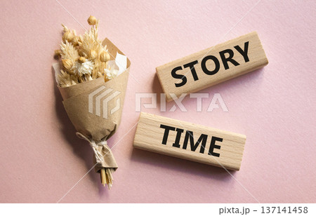 Story Time symbol. Wooden blocks with words Story Time. Beautiful pink background. Business and Story Time concept. Copy space. 137141458