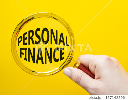 Personal Finance symbol. Magnifying Glass with words Personal Finance. Businessman hand. Beautiful yellow background. Business and Personal Finance concept. Copy space. Personal Finance symbol. Magnifying Glass with words Personal Finance. Businessman hand. Beautiful yellow background. Business and Personal Finance concept. Copy space. 137142296