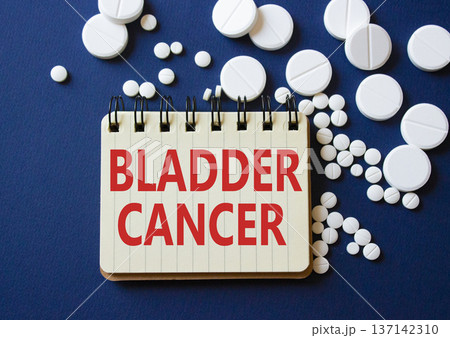 Bladder Cancer symbol. Concept word Bladder Cancer on notebook. Beautiful deep blue background with pills. Medicine and Bladder Cancer concept. Copy space 137142310