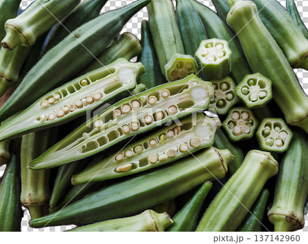 Fresh okra pods sliced open showing inner seeds and natural texture. 137142960