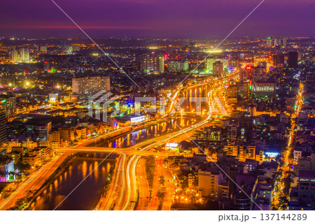 Aerial View Of Vo Van Kiet Street And Tau Hu Canal In Ho Chi Minh City At Night, Vietnam. Aerial View Of Vo Van Kiet Street And Tau Hu Canal In Ho Chi Minh City At Night, Vietnam. 137144289