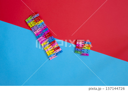 A background of many colorful wooden clothespins. A background of many colorful wooden clothespins. 137144726
