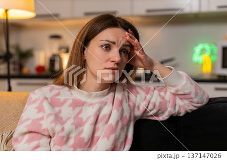 Adult woman depressed anxiety loneliness headache migraine stress at night tired mood unhappy alone 137147026
