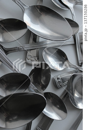 Tablespoons And Teaspoons Chaotically Scattered Vertical Stock Photo Tablespoons And Teaspoons Chaotically Scattered Vertical Stock Photo 137150286