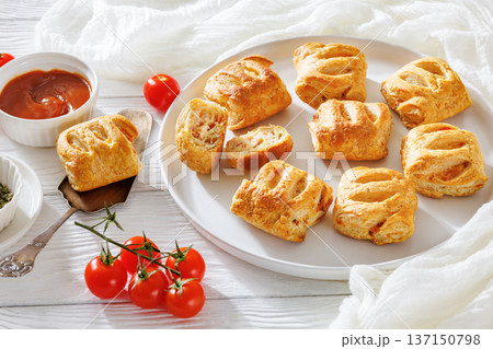 puff pastry rolls with ham, rice and cheese puff pastry rolls with ham, rice and cheese 137150798