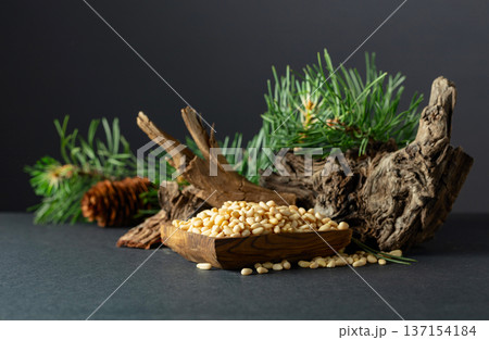 Peeled pine nuts with cedar dried snags and green branches. Peeled pine nuts with cedar dried snags and green branches. 137154184
