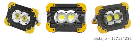 A set of three powerful portable LED rechargeable work lights shown from different angles. A set of three powerful portable LED rechargeable work lights shown from different angles. 137154250