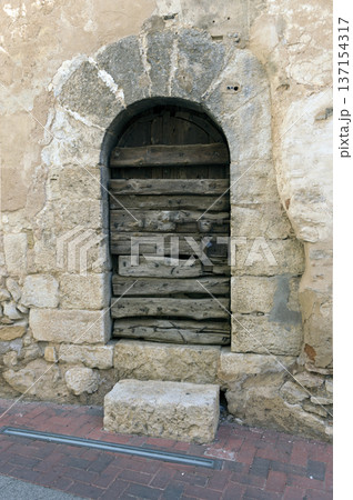 old wooden door that gives access to the castle 137154317