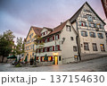 Wangen stadtmitte, germany, august 17, 2023. Meersburg, germany, showing a charming street scene with traditional half-timbered houses and inviting outdoor cafes during twilight 137154630