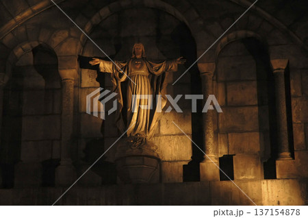 religious image pierced by a ray of light religious image pierced by a ray of light 137154878