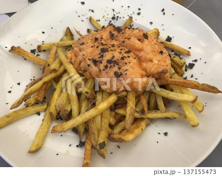 plate of fried potatoes with brava sauce 137155473