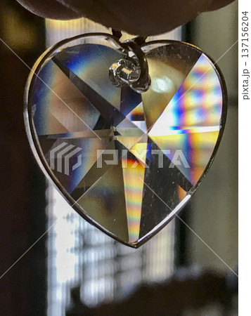 transparent crystal pendant cut in the shape of heart 137156204