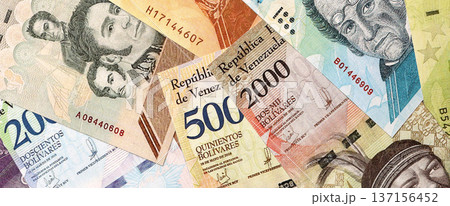 Venezuelan Bolivar currency money bills in big amount. Bunch of VED currency banknotes with different denomination close up Venezuelan Bolivar currency money bills in big amount. Bunch of VED currency banknotes with different denomination close up 137156452