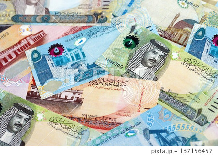 Bahraini dinar currency money bills. The current banknotes lies on table in big amount close up Bahraini dinar currency money bills. The current banknotes lies on table in big amount close up 137156457