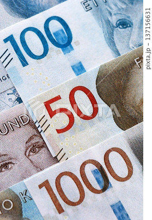 Swedish krona paper banknotes pile on table. Sweden SEK currency money bills in big amount. Concept of economics, taxation and banking in Sweden 137156631
