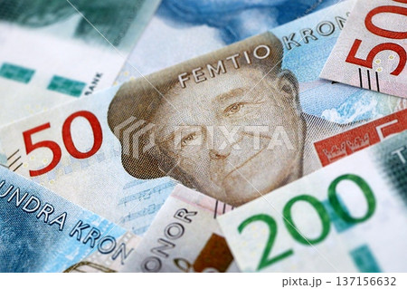 Swedish krona paper banknotes pile on table. Sweden SEK currency money bills in big amount. Concept of economics, taxation and banking in Sweden 137156632