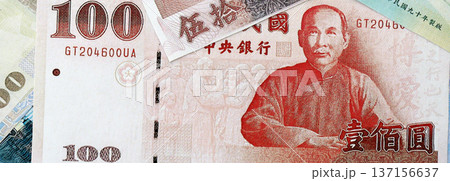 Taiwanese dollar paper banknotes pile on table. Taiwan TWD currency money bills in big amount. Concept of economics, taxation and banking in Taiwan 137156637