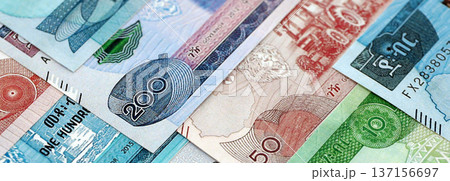 Ethiopian birr paper banknotes pile on table. Ethiopia ETB currency money bills in big amount. Concept of economics, taxation and banking in Ethiopia Ethiopian birr paper banknotes pile on table. Ethiopia ETB currency money bills in big amount. Concept of economics, taxation and banking in Ethiopia 137156697