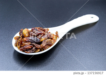 beautiful texture ripe of natural raisins on background beautiful texture ripe of natural raisins on background 137156917