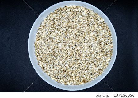 beautiful texture ripe of natural flakes oat on background beautiful texture ripe of natural flakes oat on background 137156956