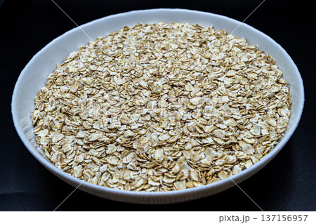 beautiful texture ripe of natural flakes oat on background beautiful texture ripe of natural flakes oat on background 137156957