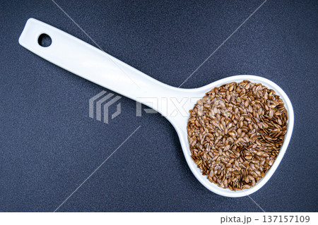 beautiful texture ripe of natural flax seeds on background beautiful texture ripe of natural flax seeds on background 137157109