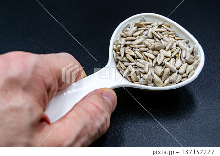beautiful texture ripe of natural sunflower seeds on background 137157227