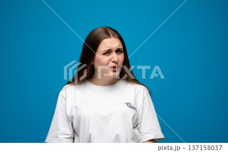 Young woman expressing skepticism, doubt, and strong disbelief with a questioning, confused face Young woman expressing skepticism, doubt, and strong disbelief with a questioning, confused face 137158037