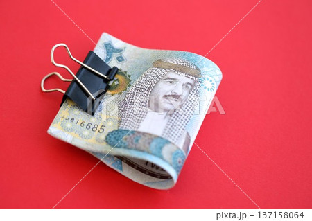 Bahraini dinar money bills in big amount on red close up. Finance and banking concept 137158064