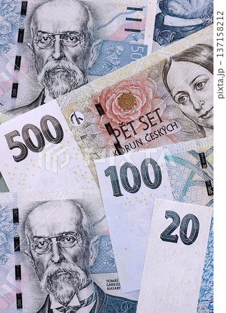 Czech koruna paper banknotes pile on table. Czech Republic CZK currency money bills in big amount. Concept of economics, taxation and banking in Czech Republic Czech koruna paper banknotes pile on table. Czech Republic CZK currency money bills in big amount. Concept of economics, taxation and banking in Czech Republic 137158212
