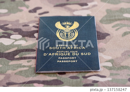 South African passport on table close up. Official identification document book for citizens of South Africa. Concept of travel and tourism 137158247