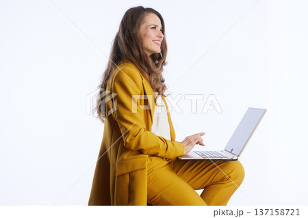 Smiling Professional Working on Laptop Smiling Professional Working on Laptop 137158721