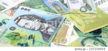Various currencies money bills banknotes in green color. Many cash bills from different countries in big pile close up. World economy and currency exchange concept 137158933