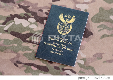 South African passport on table close up. Official identification document book for citizens of South Africa. Concept of travel and tourism 137159086