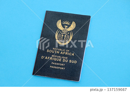 South African passport on table close up. Official identification document book for citizens of South Africa. Concept of travel and tourism 137159087